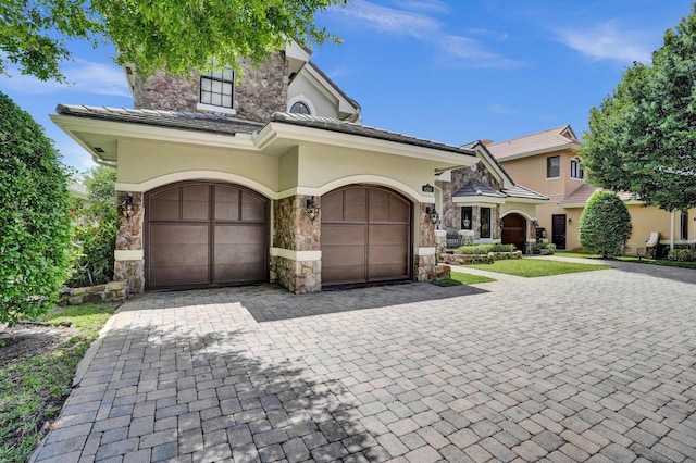 9210 Equus Cir, Boynton Beach, FL 33472 - view of front of property featuring stone siding and decorative driveway