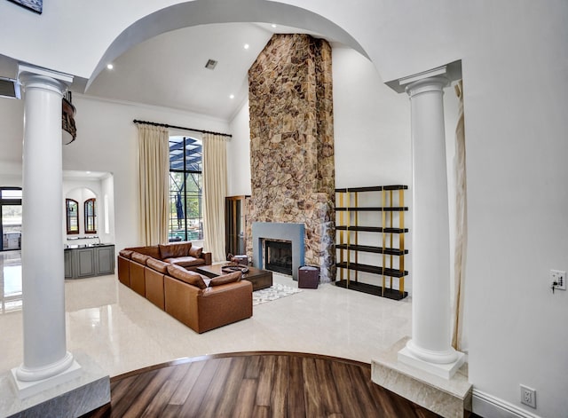 9210 Equus Cir, Boynton Beach, FL 33472 - living area with ornate columns, high vaulted ceiling, a fireplace, and recessed lighting