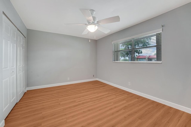 104 Lake Helen Dr, West Palm Beach, FL 33411 - unfurnished bedroom featuring light wood finished floors, baseboards, a closet, and a ceiling fan