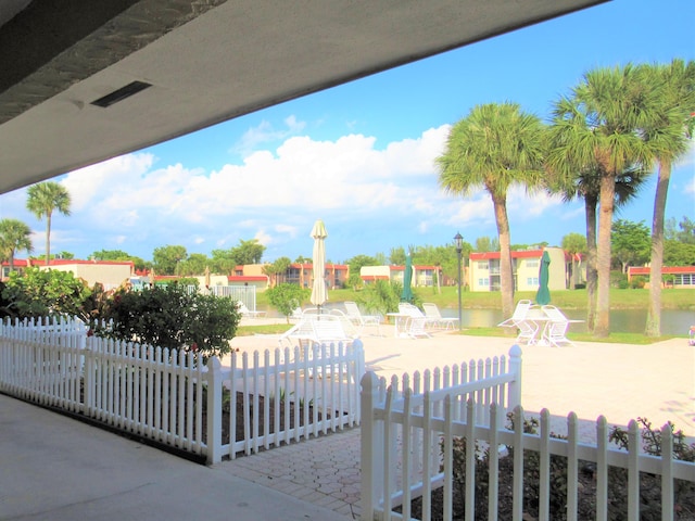 104 Lake Helen Dr, West Palm Beach, FL 33411 - surrounding community featuring a water view, a patio area, and fence private yard