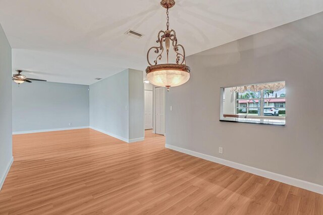 104 Lake Helen Dr, West Palm Beach, FL 33411 - empty room with baseboards, light wood-type flooring, and a ceiling fan