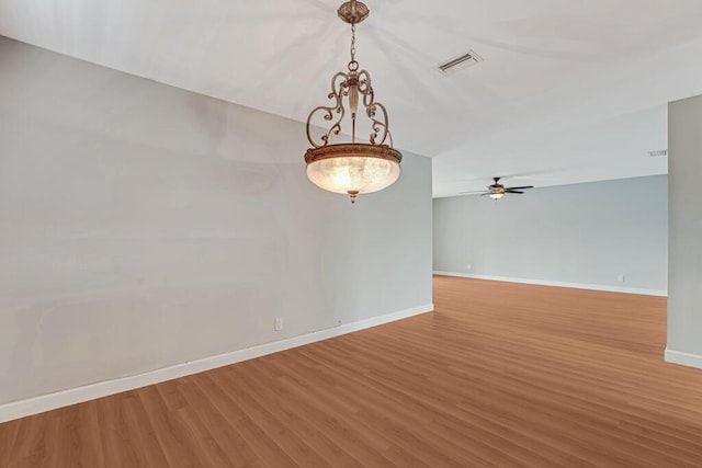 104 Lake Helen Dr, West Palm Beach, FL 33411 - spare room with a ceiling fan, visible vents, wood finished floors, and baseboards