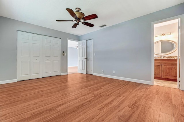 104 Lake Helen Dr, West Palm Beach, FL 33411 - unfurnished bedroom featuring light wood finished floors, baseboards, and visible vents