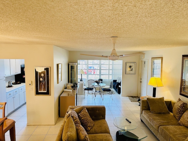 14280 Nesting Way Unit B, Delray Beach, FL 33484 - living area featuring a textured ceiling, a ceiling fan, and light tile patterned floors