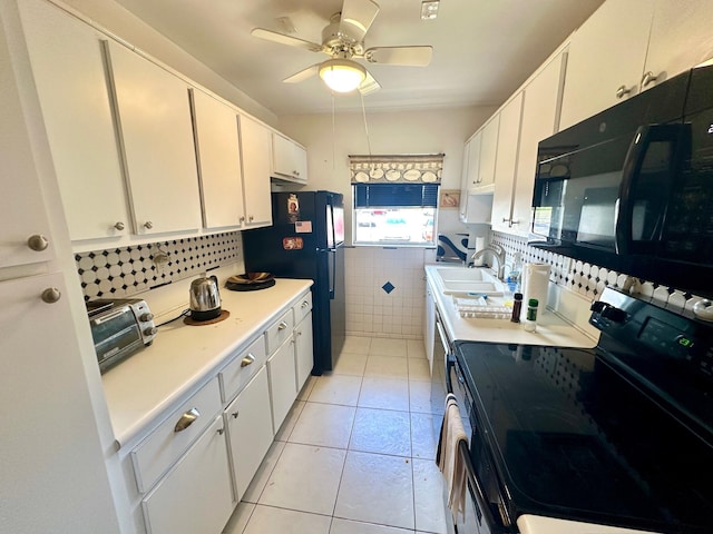 14280 Nesting Way Unit B, Delray Beach, FL 33484 - kitchen featuring a sink, black appliances, a toaster, light countertops, and white cabinets