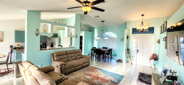 tiled living area with a chandelier, a ceiling fan, vaulted ceiling, and a textured ceiling