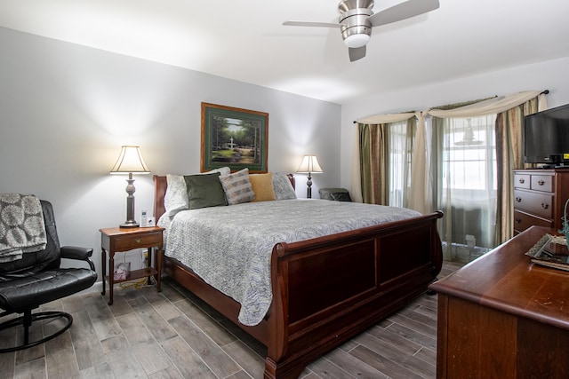bedroom featuring dark wood-style flooring and a ceiling fan