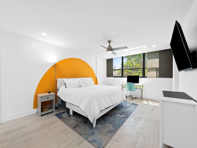 bedroom with baseboards, light wood-style flooring, ceiling fan, and recessed lighting