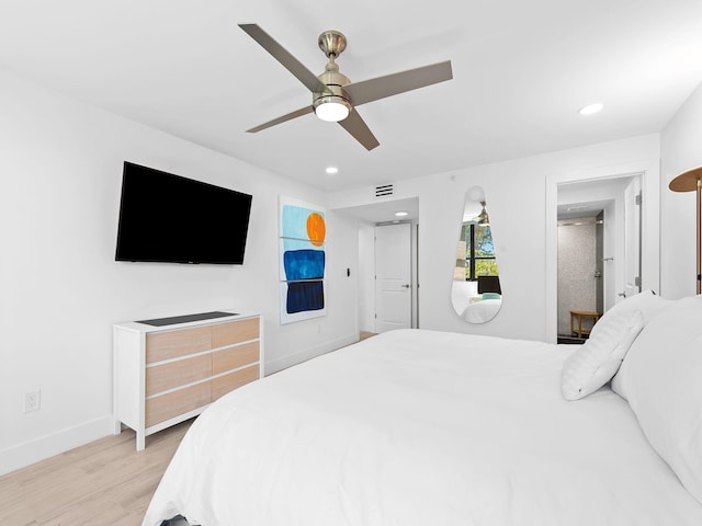 bedroom featuring baseboards, visible vents, light wood-style floors, and recessed lighting