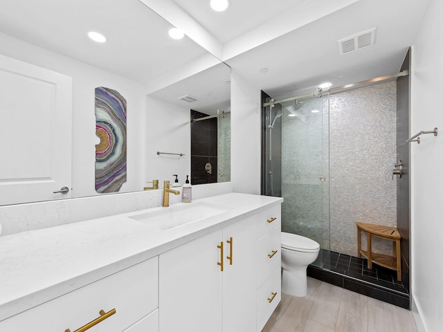 full bath with a stall shower, visible vents, toilet, and vanity