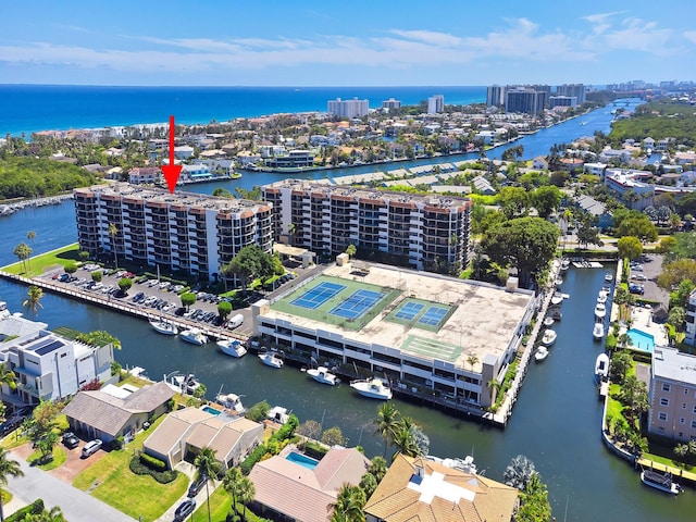 bird's eye view featuring a water view and a city view