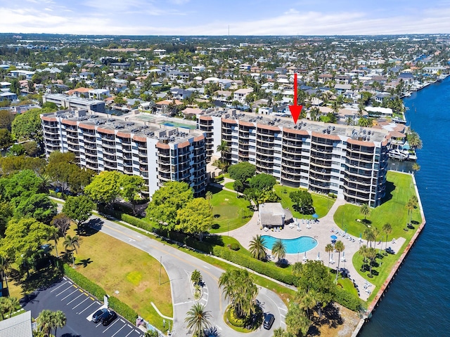 birds eye view of property with a water view