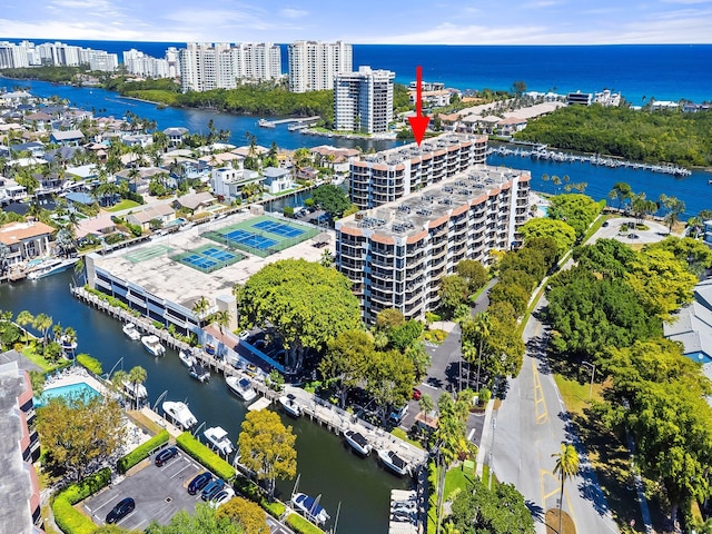 bird's eye view featuring a water view and a view of city