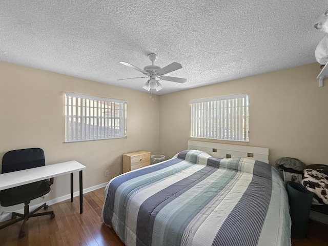 6875 NW 1st Ct, Margate, FL 33063 - bedroom with a textured ceiling, baseboards, a ceiling fan, and wood finished floors