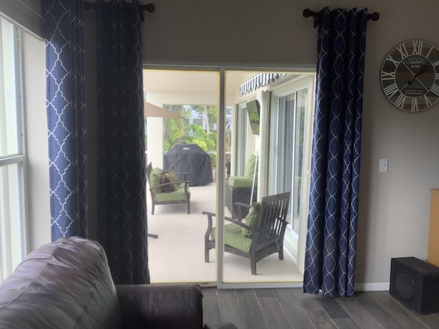 7007 Ashton St, Boynton Beach, FL 33437 - doorway featuring baseboards and wood finished floors
