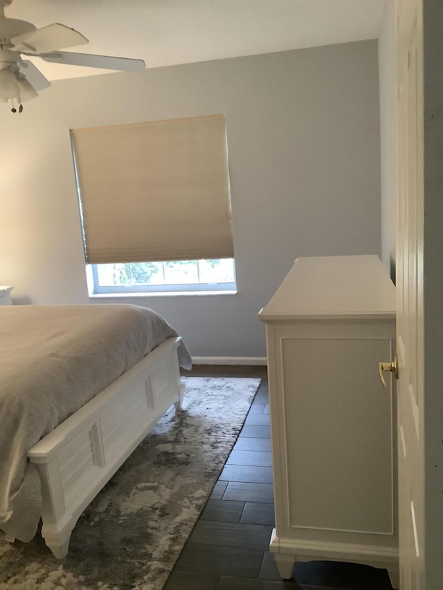7007 Ashton St, Boynton Beach, FL 33437 - bedroom featuring baseboards, a ceiling fan, and dark wood finished floors