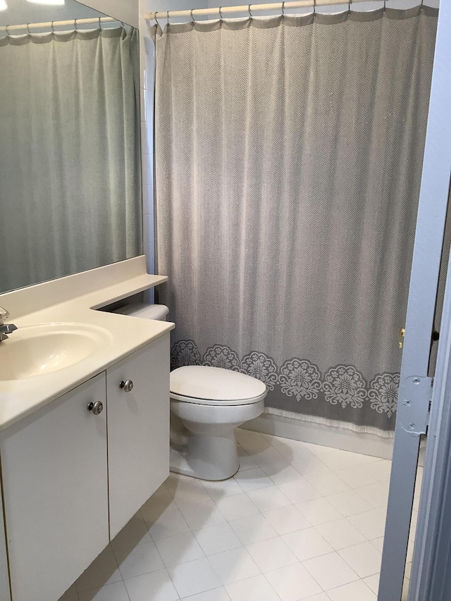 7007 Ashton St, Boynton Beach, FL 33437 - bathroom with toilet, tile patterned floors, vanity, and curtained shower