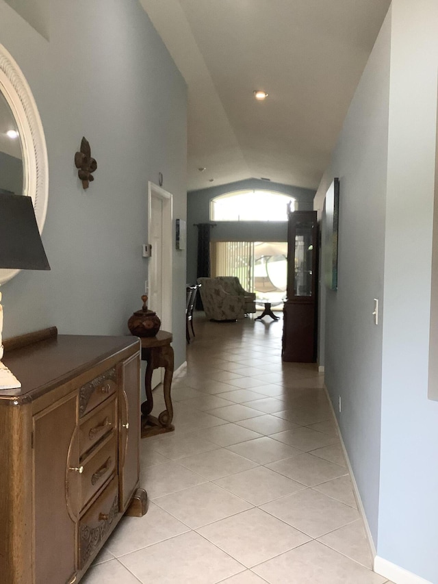 7007 Ashton St, Boynton Beach, FL 33437 - hall featuring light tile patterned floors, baseboards, and vaulted ceiling