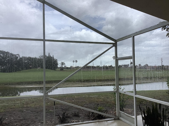 7007 Ashton St, Boynton Beach, FL 33437 - unfurnished sunroom featuring a water view