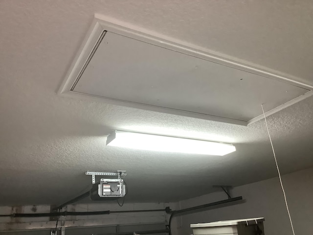 7007 Ashton St, Boynton Beach, FL 33437 - details with a garage door opener and a textured ceiling