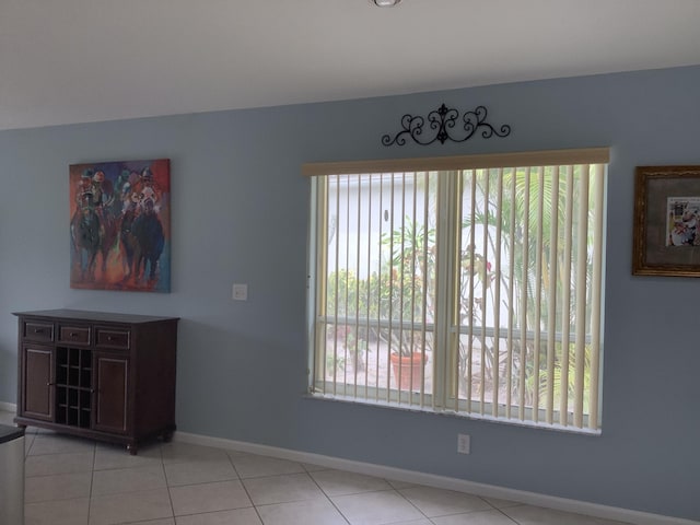7007 Ashton St, Boynton Beach, FL 33437 - unfurnished dining area featuring tile patterned flooring and baseboards