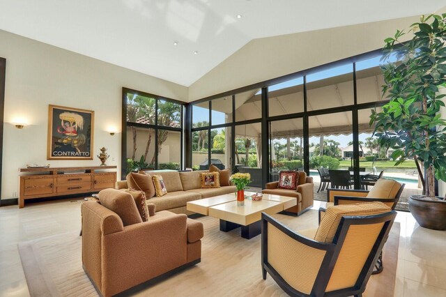 13315 Deauville Dr, Palm Beach Gardens, FL 33410 - living area featuring light tile patterned flooring, plenty of natural light, and high vaulted ceiling