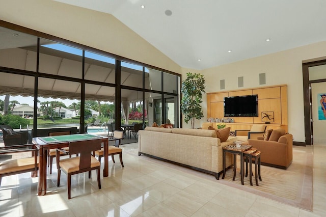 13315 Deauville Dr, Palm Beach Gardens, FL 33410 - living room featuring high vaulted ceiling and light tile patterned floors
