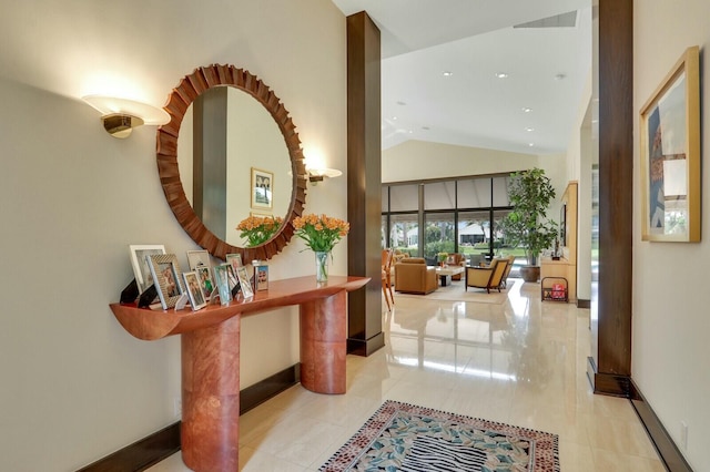 13315 Deauville Dr, Palm Beach Gardens, FL 33410 - hall featuring high vaulted ceiling and baseboards