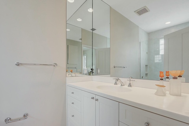 13315 Deauville Dr, Palm Beach Gardens, FL 33410 - bathroom with visible vents, a walk in shower, and vanity