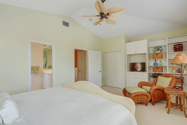 13315 Deauville Dr, Palm Beach Gardens, FL 33410 - bedroom with ensuite bathroom, a closet, visible vents, vaulted ceiling, and light colored carpet