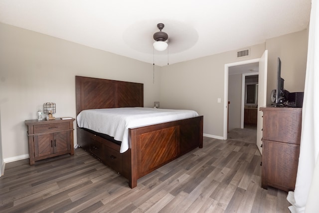 bedroom featuring baseboards, ceiling fan, light wood-style flooring, and visible vents