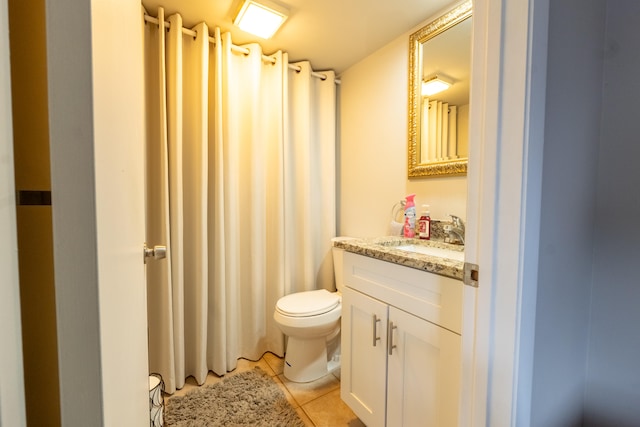 bathroom featuring toilet, tile patterned floors, curtained shower, and vanity