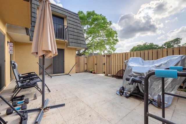 view of patio / terrace with fence and a gate