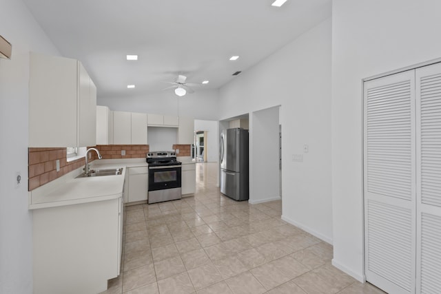 22586 Esplanada Dr, Boca Raton, FL 33433 - kitchen featuring light countertops, stainless steel appliances, a ceiling fan, tasteful backsplash, and a sink