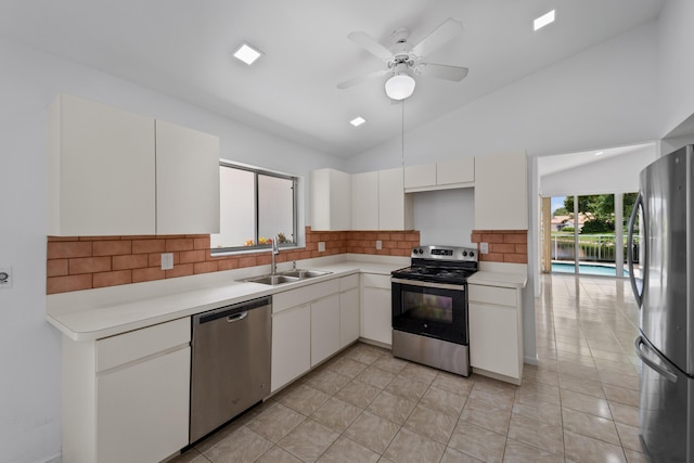 22586 Esplanada Dr, Boca Raton, FL 33433 - kitchen featuring light countertops, stainless steel appliances, a sink, white cabinets, and a ceiling fan