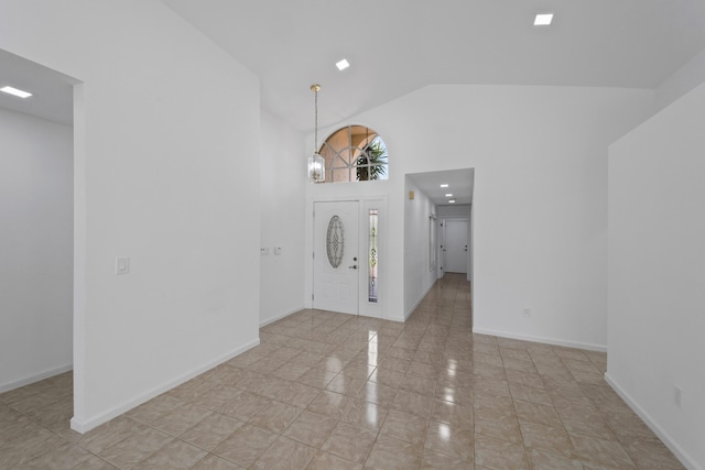 22586 Esplanada Dr, Boca Raton, FL 33433 - foyer entrance with baseboards, high vaulted ceiling, and an inviting chandelier