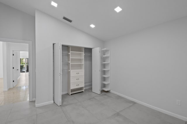 22586 Esplanada Dr, Boca Raton, FL 33433 - unfurnished bedroom featuring baseboards, visible vents, a closet, and high vaulted ceiling