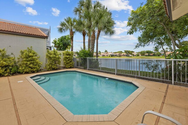 22586 Esplanada Dr, Boca Raton, FL 33433 - view of swimming pool featuring a fenced in pool, a water view, fence, and a patio area