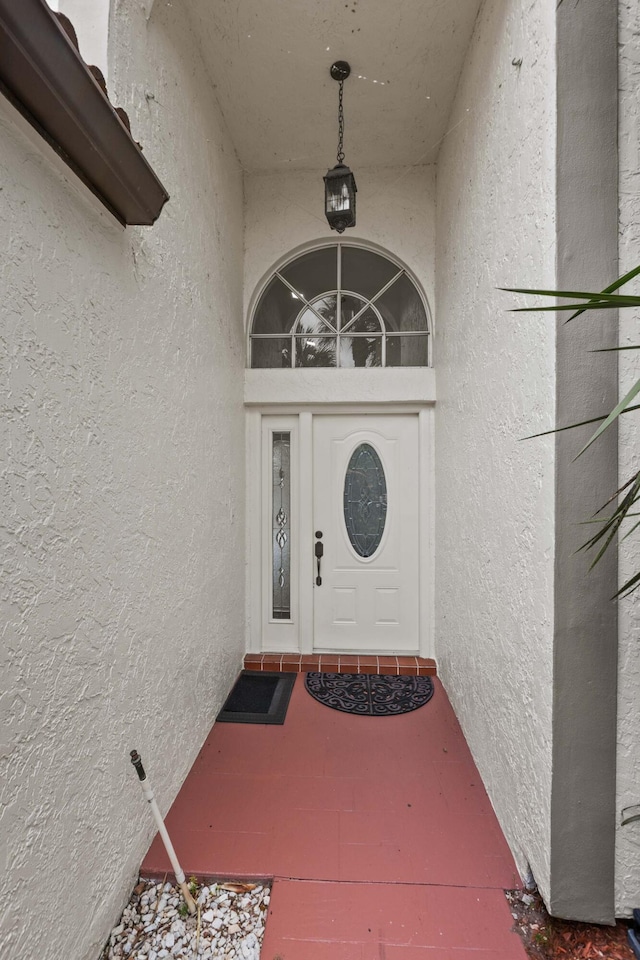 22586 Esplanada Dr, Boca Raton, FL 33433 - doorway to property with stucco siding