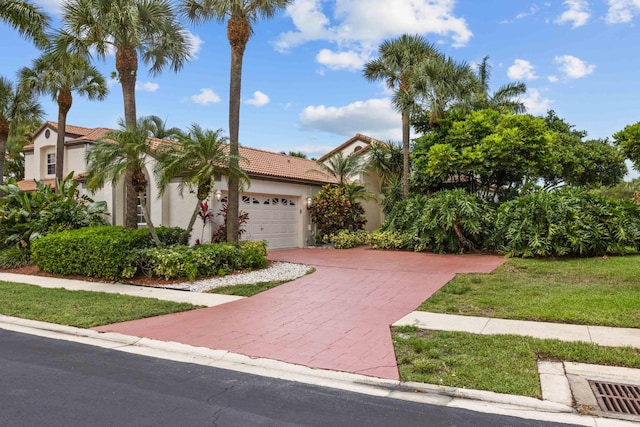 22586 Esplanada Dr, Boca Raton, FL 33433 - view of front of home featuring a tiled roof, a garage, decorative driveway, and stucco siding