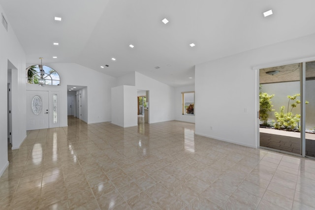 22586 Esplanada Dr, Boca Raton, FL 33433 - unfurnished living room featuring baseboards, vaulted ceiling, visible vents, and light tile patterned floors