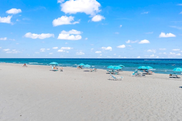 property view of water featuring a beach view