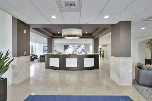 reception area with visible vents and arched walkways