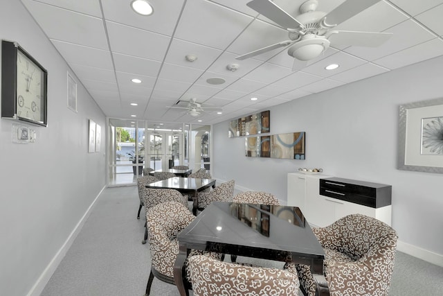 carpeted dining space featuring baseboards, visible vents, ceiling fan, recessed lighting, and a paneled ceiling