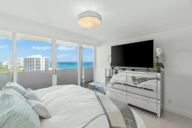 bedroom with baseboards, access to outside, and crown molding