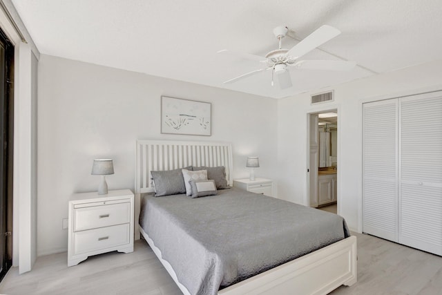 10000 S Ocean Dr S Unit 601, Jensen Beach, FL 34957 - bedroom with a closet, light wood finished floors, ensuite bathroom, visible vents, and ceiling fan