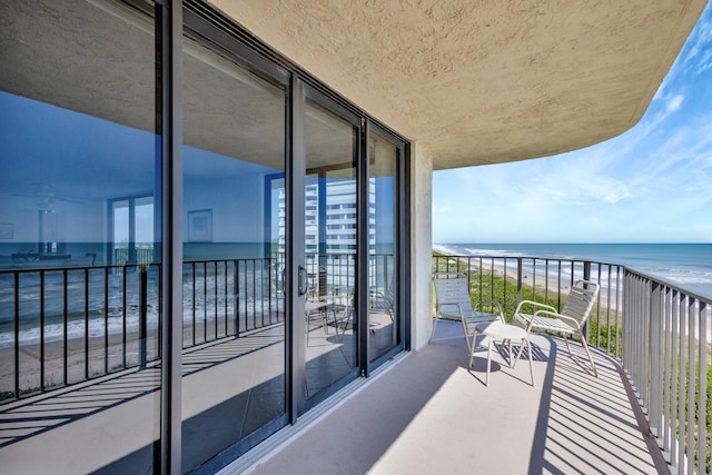 10000 S Ocean Dr S Unit 601, Jensen Beach, FL 34957 - balcony featuring a water view and a view of the beach
