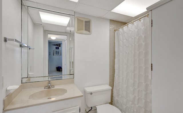 10000 S Ocean Dr S Unit 601, Jensen Beach, FL 34957 - full bath featuring a shower with curtain, toilet, vanity, and a paneled ceiling
