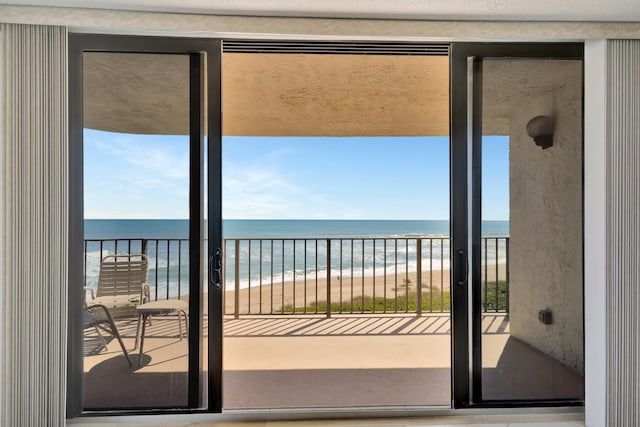 10000 S Ocean Dr S Unit 601, Jensen Beach, FL 34957 - balcony featuring a water view and a beach view