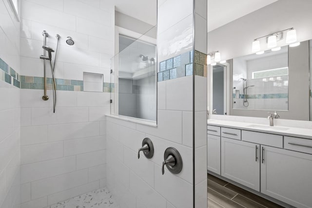 13526 Sw Vermillion Circle Mystique, Port Saint Lucie, FL 34987 - full bathroom with a walk in shower, vanity, and wood finished floors